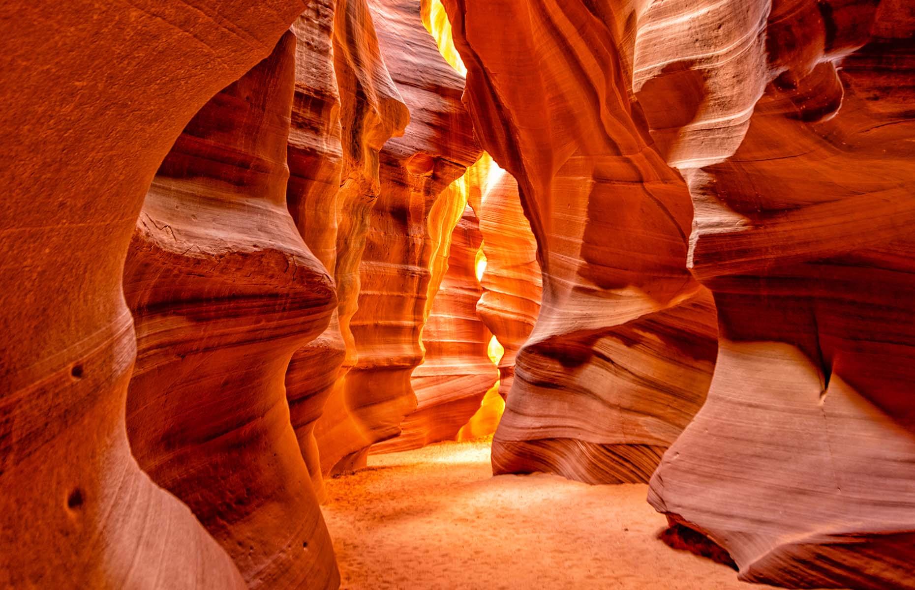 The valleys of Antelope Canyon in Arizona were created over thousands of years by flash flooding, which eroded the sandstone pathways and shaped the distinctive curves you see today. What many don't know is that it's actually two separate slot canyons – Upper Antelope Canyon, or The Crack, and Lower Antelope Canyon, or The Corkscrew – but both make for a mesmerising sight.