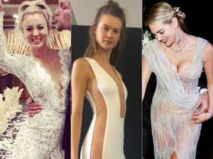 Kaley Cuoco, Behati Prinsloo posing for a photo:  Celebrities including Priyanka Chopra Jonas and Hailey Bieber have embraced daring trends on their wedding days. Behati Prinsloo wore a dress with cutouts down to her thighs and a low neckline in the front. Gwen Stefani embraced her classic rocker style with a tulle minidress. Visit Insider's homepage for more stories. Read the original article on Insider
