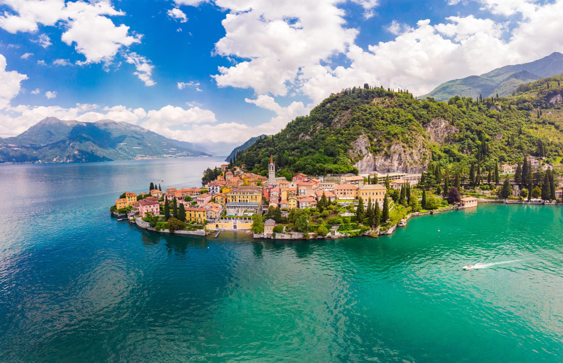 <p>Boat is the most practical and pleasurable way to get around the 20-mile-long (32km) lake, so hire a motorboat or <a href="https://taxiboatvarenna.com/lake-como-visit-villa-balbianello-boat-tour/">taxi boat</a> to speed, 007 style, between mansions and pretty lakeside towns such as Bellagio and Varenna (pictured), which clings to a rocky headland opposite. There are plenty of swanky lakeside spots to stop for martinis and seafood lunches, and to explore cobbled lanes for hidden-away trysts and old-school trattorias. Another of Como's historic lakeside mansions is the exquisite <a href="https://www.villacarlotta.it/">Villa Carlotta </a>with its lush gardens. Keep the thrills going like Bond by catching a train to Venice, whose canals, palazzo and piazzas also dazzled in <em>Casino Royale </em>(and a good few other Bond movies).</p>