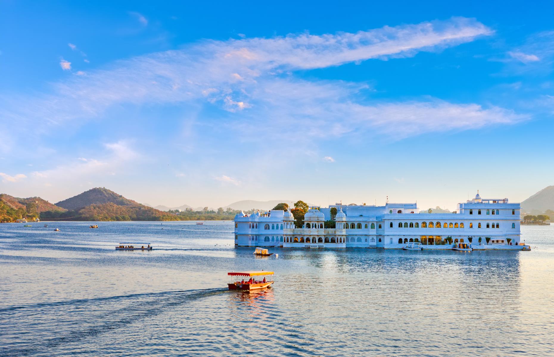 <p>The romantic palaces and dreamy waterways of Rajasthan’s ravishing city Udaipur have long captured travelers' and artists’ imaginations. It mesmerized viewers in <em>Octopussy</em> when its Lake Palace, one-time summer residence of the city's rulers, appeared as the opulent home of the movie’s eponymous wealthy businesswoman. The floating 18th-century palace, which is set on an island in Lake Pichola, is <a href="https://www.tajhotels.com/en-in/taj/taj-lake-palace-udaipur/">now part of the luxury Taj Hotel Group</a>. The old laneways of the so-called Venice of the East also featured extensively in the 1983 movie.</p>