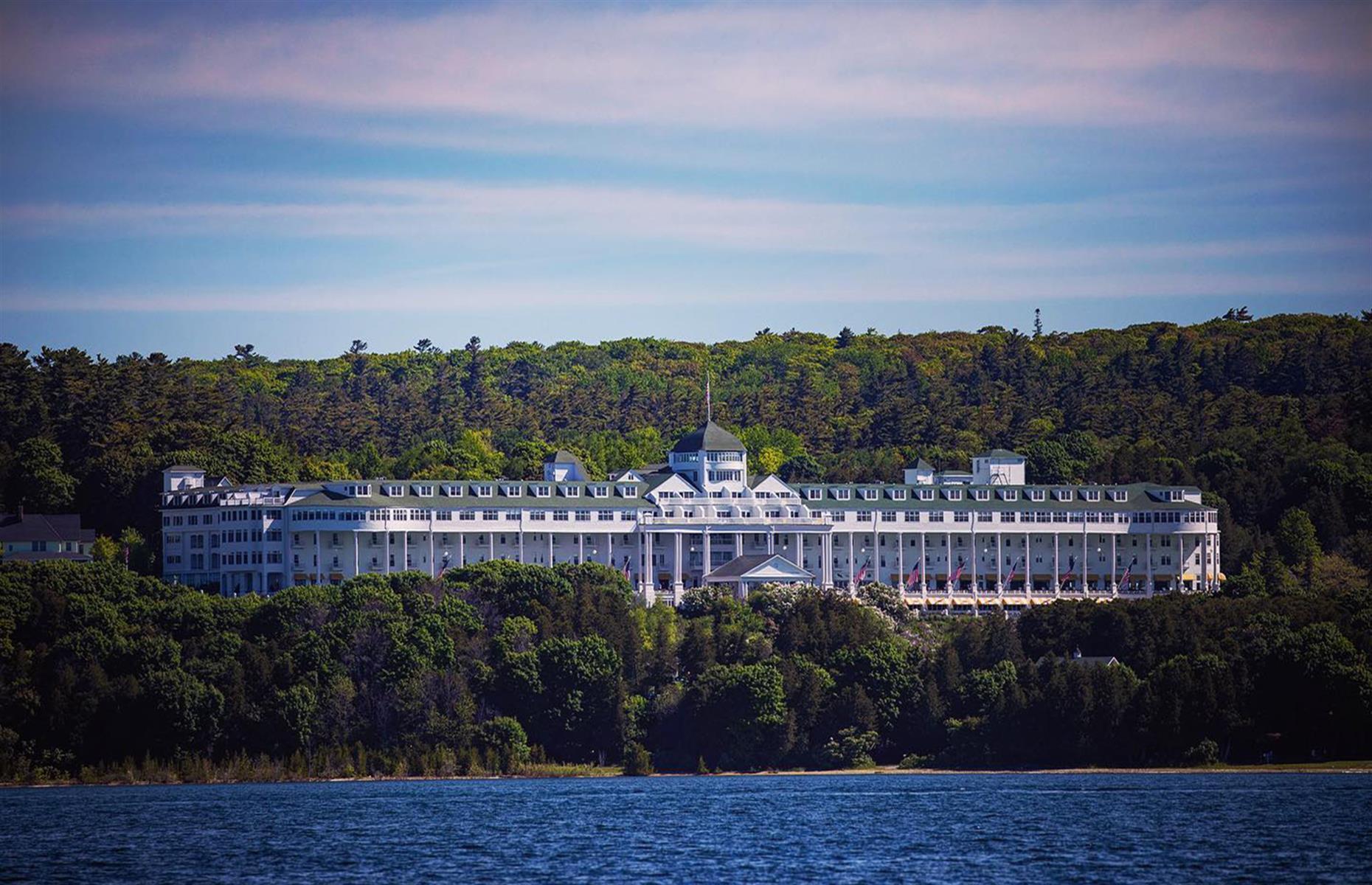 <p>Mackinac Island's <a href="https://www.grandhotel.com/">Grand Hotel</a> proudly tips itself as the "world's largest summer hotel", but it may also be among the most haunted. The hotel opened back in 1887, playing host to movie stars and literary icons like Mark Twain – though today it's equally as well known for its ghostly guests. Over the years, visitors have reported sighting a mysterious black cloud and a smartly dressed specter in a top hat.</p>  <p><a href="https://www.loveexploring.com/galleries/75540/american-hotels-hiding-historic-secrets?page=1"><strong>Take a look at the American hotels hiding historic secrets</strong></a></p>