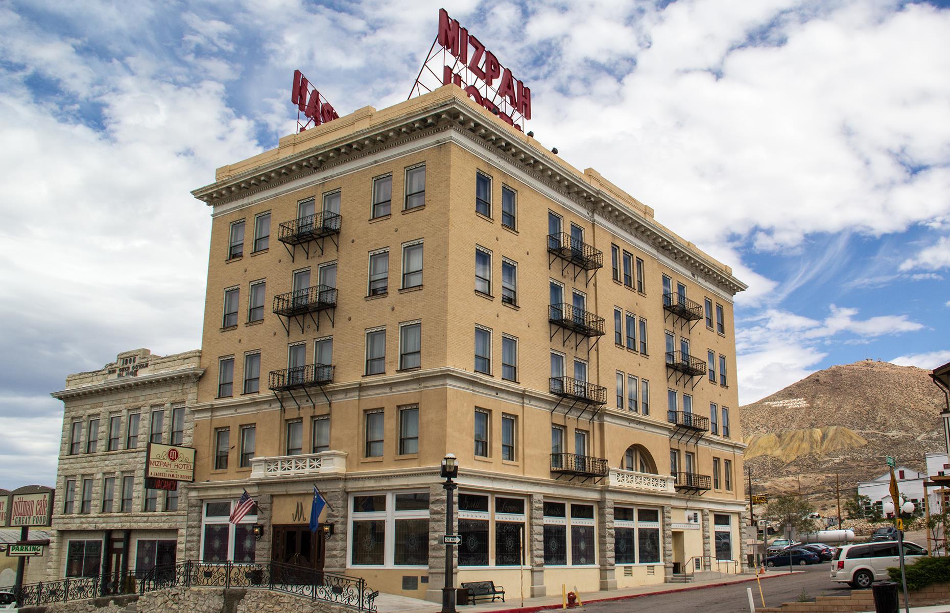 <p><a href="https://www.themizpahhotel.com/">The Mizpah Hotel</a> – which sprang up in 1907 when Tonopah was a thriving mining town – is no stranger to lists of America's most haunted places. It's known as the "Jewel of the Desert" for its opulent suites, all heavy red drapes and glistening chandeliers, and since it reopened in 2011 after more than a decade of desertion, it's embraced its reputation for phantoms and frights. It's said that the ghosts here are the friendly kind, and they include the Lady in Red, the spirit of a woman tragically murdered by her lover. She apparently leaves pearls for guests she takes a particular liking to.</p>