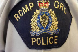 a close up of a person: File: The RCMP badge.