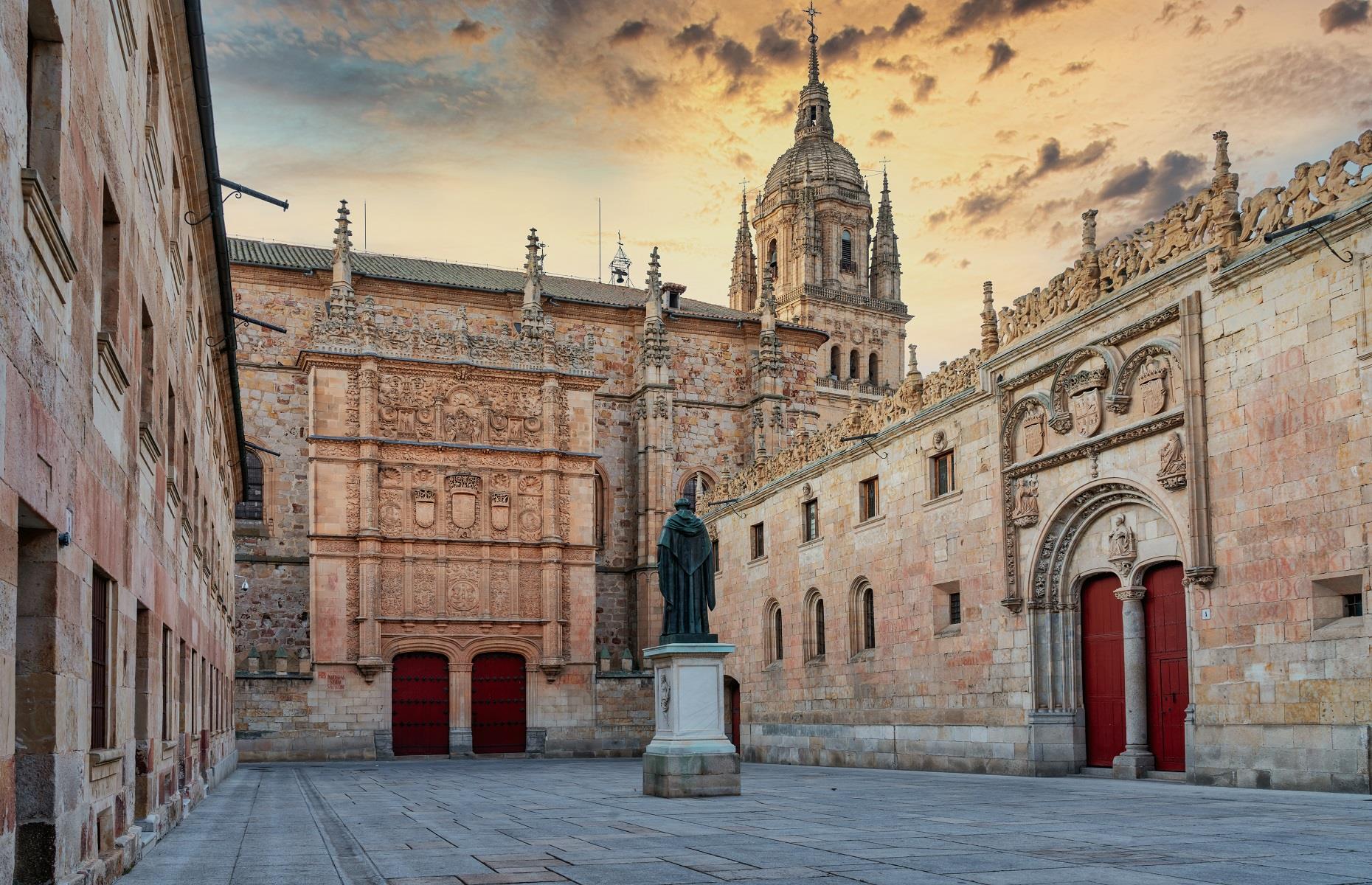 <p>On the complete opposite end of the architectural spectrum, you'll find the <a href="https://www.usal.es/">University of Salamanca</a>. Founded in the 12th century, this institution is one of the oldest universities in existence. The college was given a Royal Charter by King Alfonso IX in 1218 and blends Romanesque, Gothic, Moorish, Renaissance and Baroque architecture. In fact, the entire city of Salamanca was named a UNESCO World Heritage Site in 1988.</p>