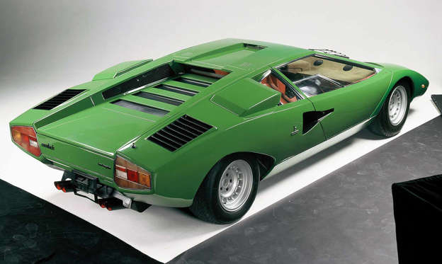 Slide 2 of 22: The first series production Countach, the LP400, debuted in 1974 and continued until 1978. Featuring space-age Bertone design uncluttered by spoilers or flared wheelarches, the spectacular supercar stood just 42 inches tall. A longitudinal V12 (Longitudinale Posteriore, or LP) produced 375 horsepower. The surprise new 2022 Countach offers more than twice the output, but we can’t get half as excited about it.