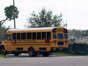 A Collier County School District bus drives into the parking lot at the Boys and Girls Club of Collier County, Tuesday, Oct. 19, 2021. Neighbors say the construction near the intersection of Davis and Santa Barbara boulevards is causing air quality issues and leaving dust on adjacent properties.