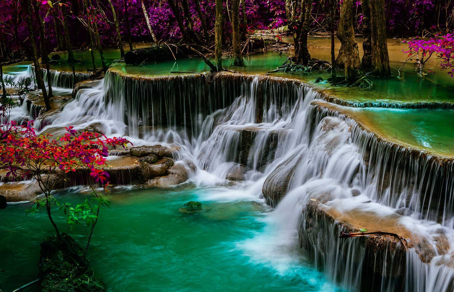 This breathtaking natural wonder is considered one of Thailand's finest waterfalls. Found inside Srinakarin Dam National Park in western Thailand, the tiered fall drops for seven levels and stretches around 1.2 miles (2km). Surrounded by a stunning jungle landscape, this scenic chain of waterfalls is especially picturesque in fall.