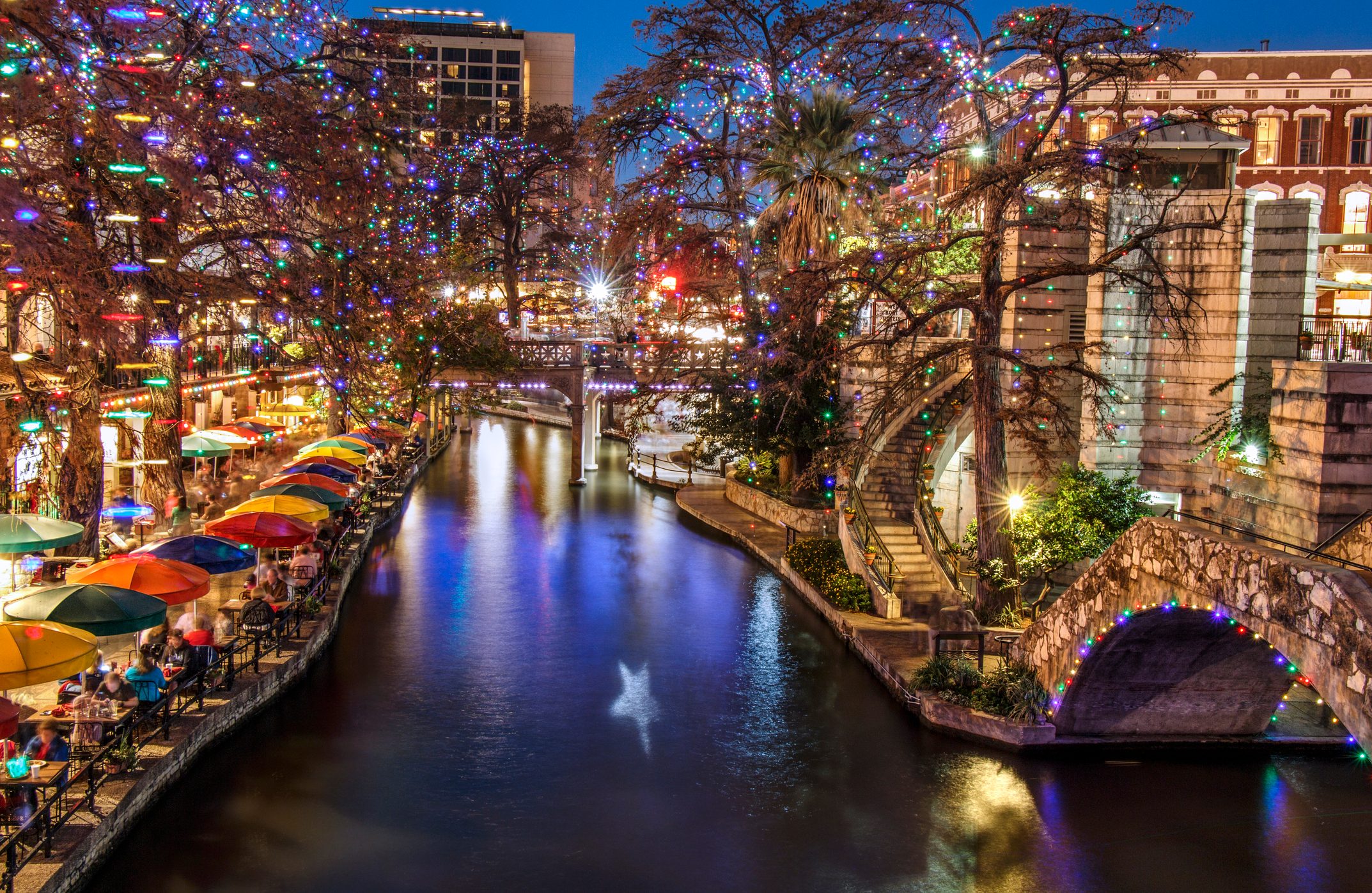 <p><strong>Best for:</strong> Riverside strolls</p> <p>San Antonio stands out as one of the best Christmas towns for the unparalleled setting of its River Walk, decorated for the holidays with thousands of lights hung on the bald cypress trees that line the river. The season kicks off with a Holiday River Parade of floats on boats along the river; then the illuminated River Walk is open (and free) nightly. Visitors can also book a caroling boat and belt out their favorite Christmas tunes; or enjoy them from the riverside. The San Antonio Botanical Gardens also have amazing illuminations with their Lightscape walking event, featuring lights set among the gardens as well as a "Cathedral of Light," 100,000 bulbs in a glorious archway. Food, drinks, and s'mores round out the festivities.</p> <p>Stay at the historic 1859 hotel The Menger, with an awesome location one block from the River Walk, as well as a block from the famous Alamo. Surprisingly affordable, the property's amazing lobby atrium looks fabulous decorated for Christmas.</p> <p class="listicle-page__cta-button-shop"><a class="shop-btn" href="https://www.tripadvisor.com/Hotel_Review-g60956-d99531-Reviews-Menger_Hotel-San_Antonio_Texas.html#REVIEWS">Book Now</a></p>