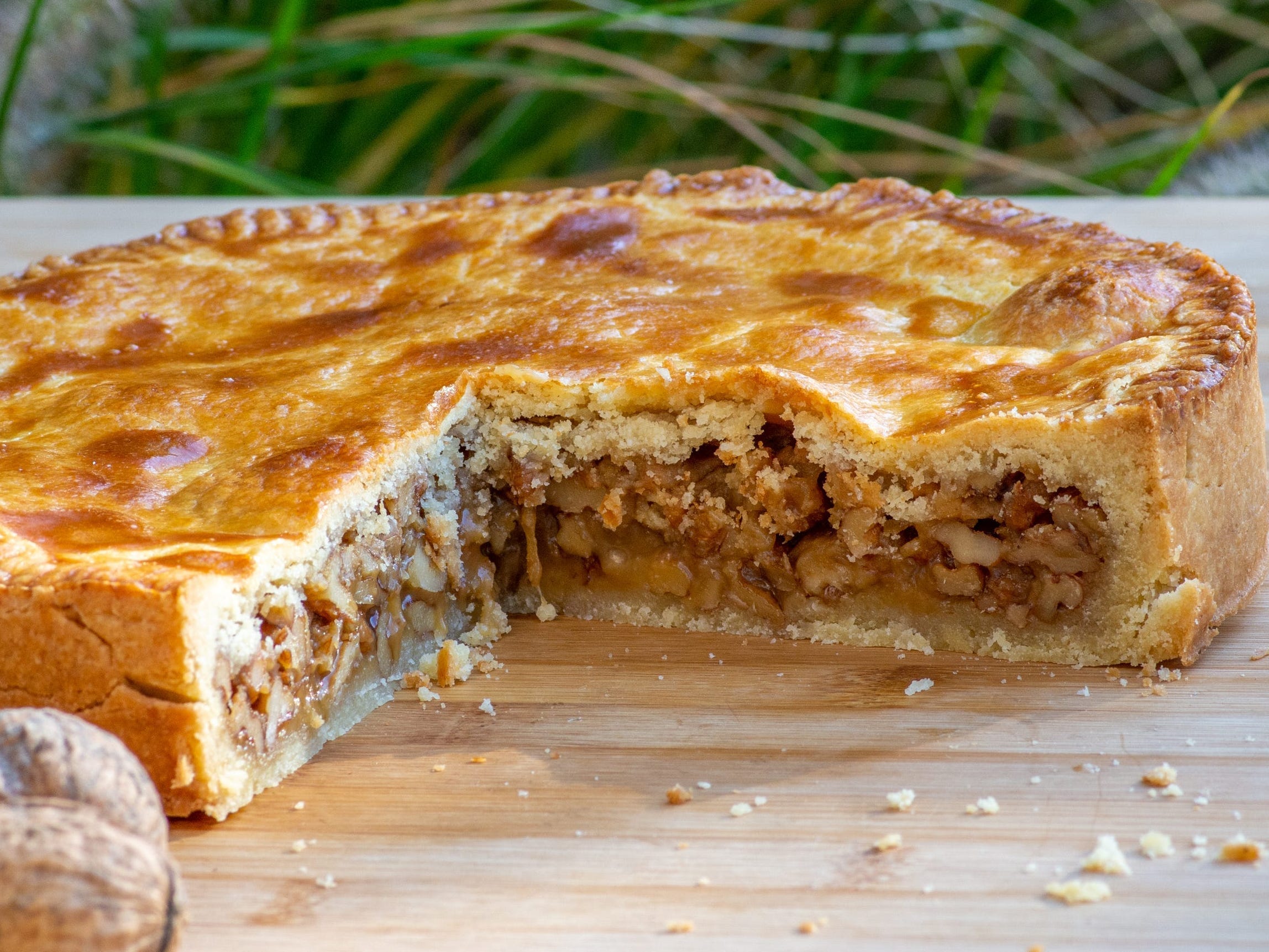 <p><a href="https://www.tasteatlas.com/bundner-nusstorte/recipe">According to Taste Atlas</a>, this German pastry is made with caramelized walnuts and cream. </p><p>Although some trace this pie's origins to the canton of Graubünden, <a href="https://www.insider.com/best-pumpkin-pie-i-ever-made-recipe-bobby-flay-2021-10">the dessert</a> was actually brought to the region from the south where the walnut grows, according to the <a href="https://www.graubuenden.ch/en/experience-graubunden/culinary-arts/recipe-graubunden-nut-pie" rel="noopener">official tourism website for Graubünden</a>.</p>