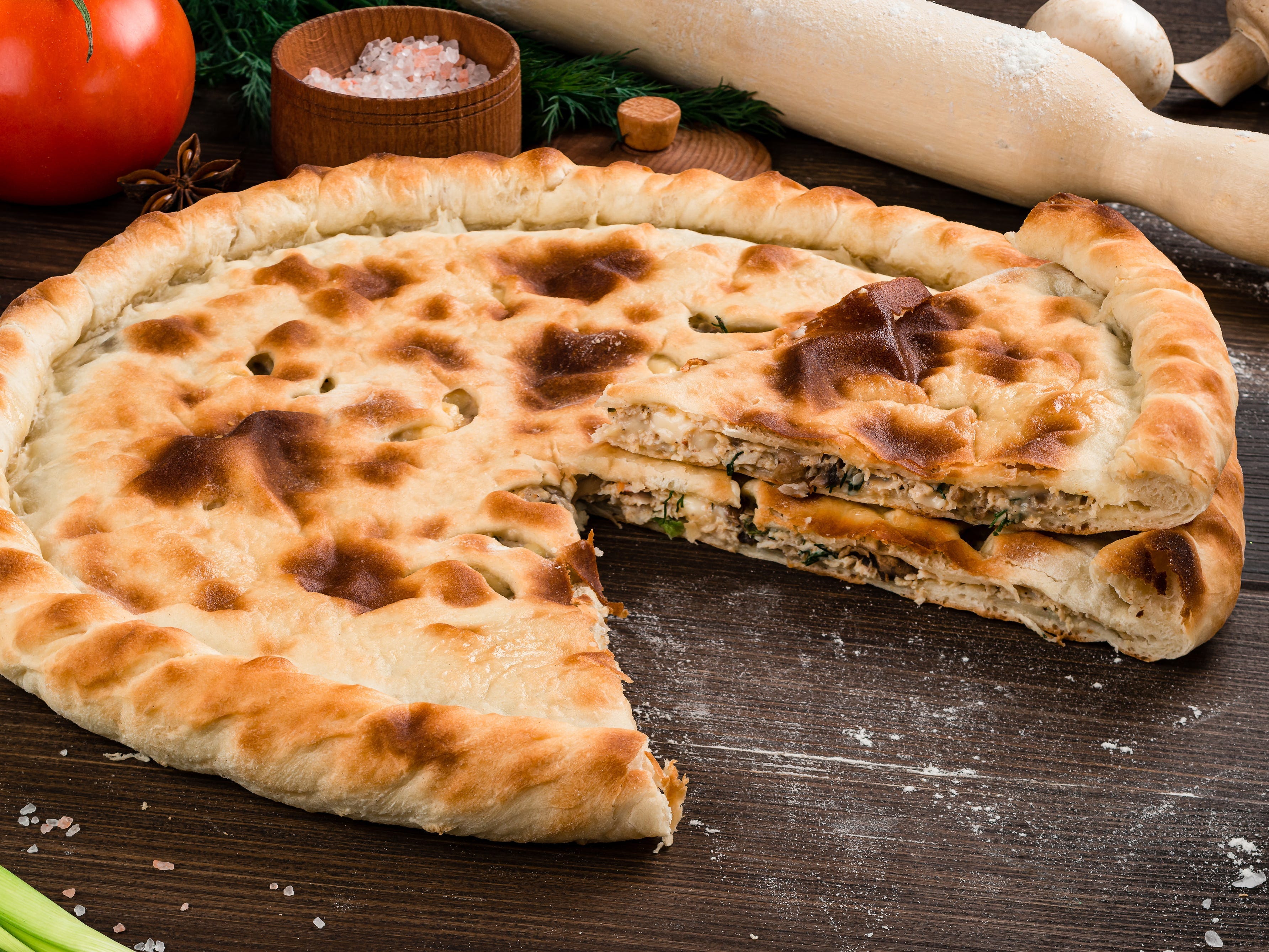 <p><a href="https://www.tasteatlas.com/ossetian-khachapuri">According to Taste Atlas</a>, Ossetian khachapuri (or Ossetian pie) originates from Georgia. </p><p>It's made with boiled potatoes and <a href="https://www.insider.com/trying-cheap-and-expensive-grilled-cheeses-review-photos-2021-7">creamy cheese</a> folded into the dough.</p>