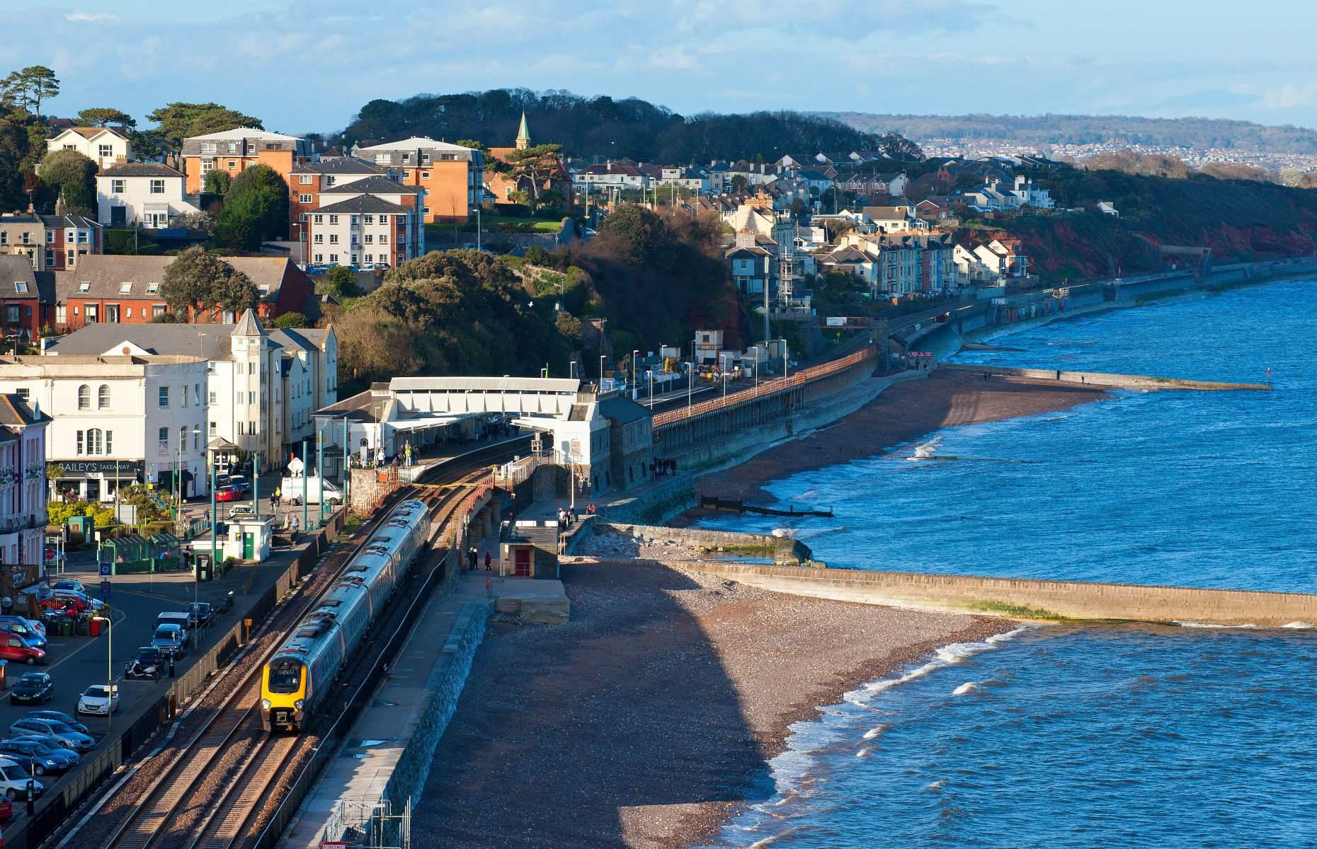 <p>The <a href="https://greatscenicrailways.co.uk/lines/riviera-line/">Riviera Line</a> runs 28 miles (46km) along the south Devon coast between Exeter and Paignton and is one of the country’s much-loved railways. Hugging the coastline, the journey begins at the bustling city of Exeter before passing by several pretty seaside towns including Dawlish and Teignmouth, plus dramatic cliff formations as it travels towards the picturesque English Riviera to Paignton.</p>