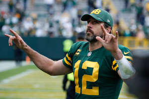 Green Bay Packers' Aaron Rodgers reacts as he leaves the field after during the second half of an NFL football game against the Washington Football Team Sunday, Oct. 24, 2021, in Green Bay, Wis.