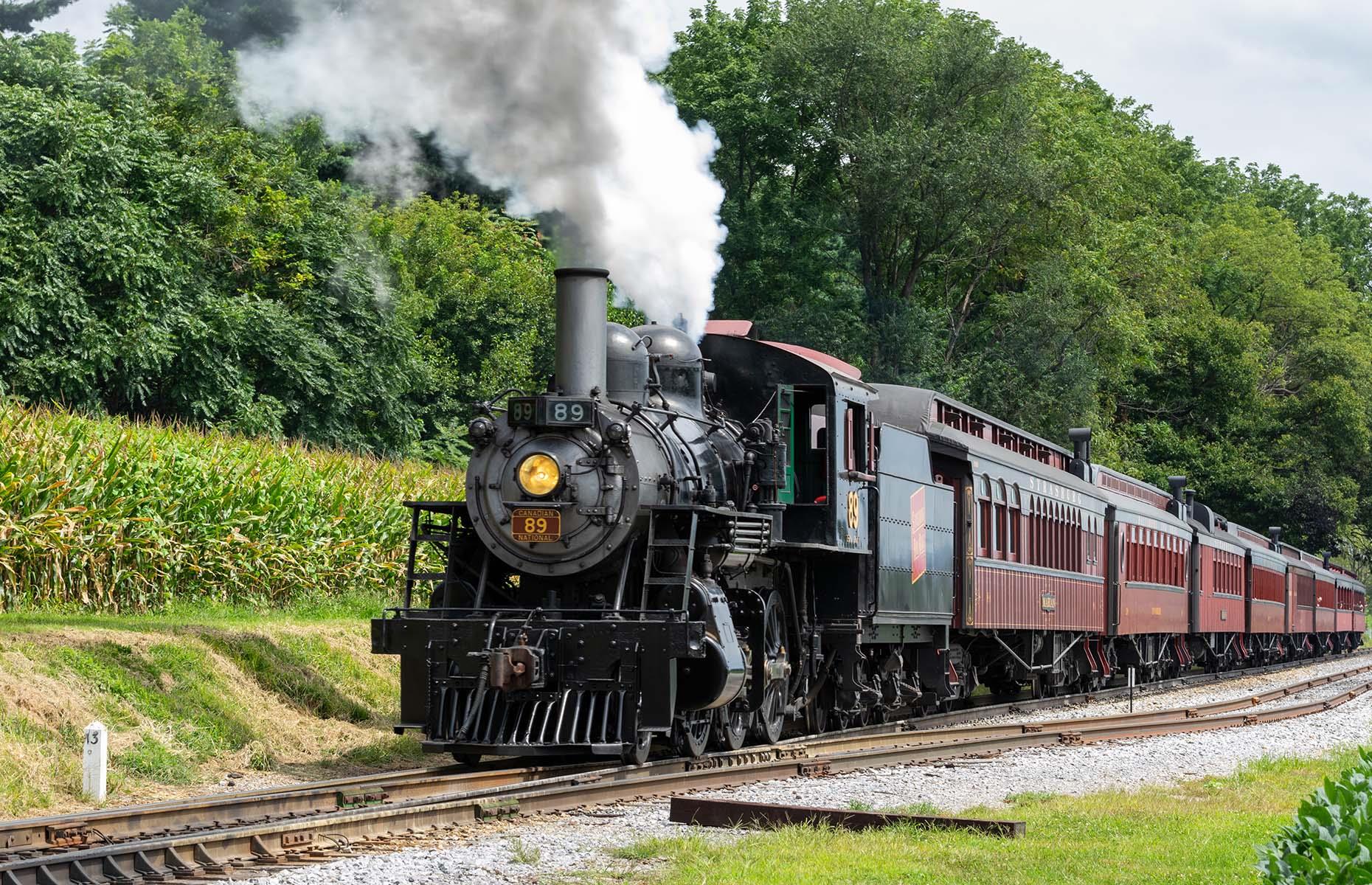 <p>America’s oldest operating railroad, the <a href="https://www.strasburgrailroad.com/">Strasburg Rail Road</a> first puffed off the buffers in 1832. Today it takes its passengers on a whistle-stop tour through Pennsylvanian Amish country. Four steam locomotives still pull original rolling stock on the 45-minute round trip to and from Paradise, and an audio commentary dispenses nuggets of knowledge on the nation’s oldest continuously operating short line railway.</p>