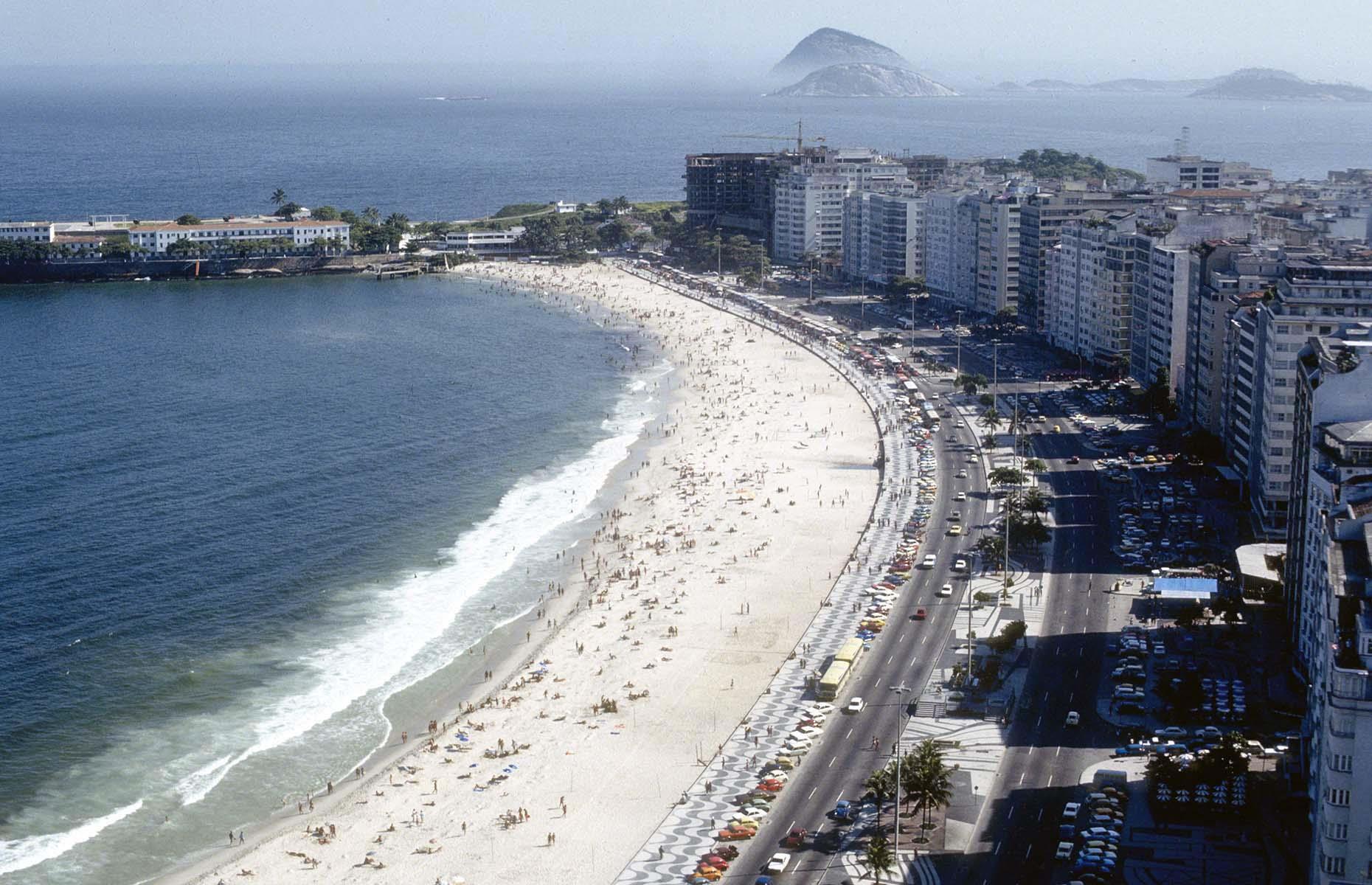 Copacabana's popularity boomed in the 1970s, a decade that saw several hotel redevelopments, the relaying of the promenade tiles and further airline links to Europe and the US. Here, thriving Copacabana is captured in the late 1970s.