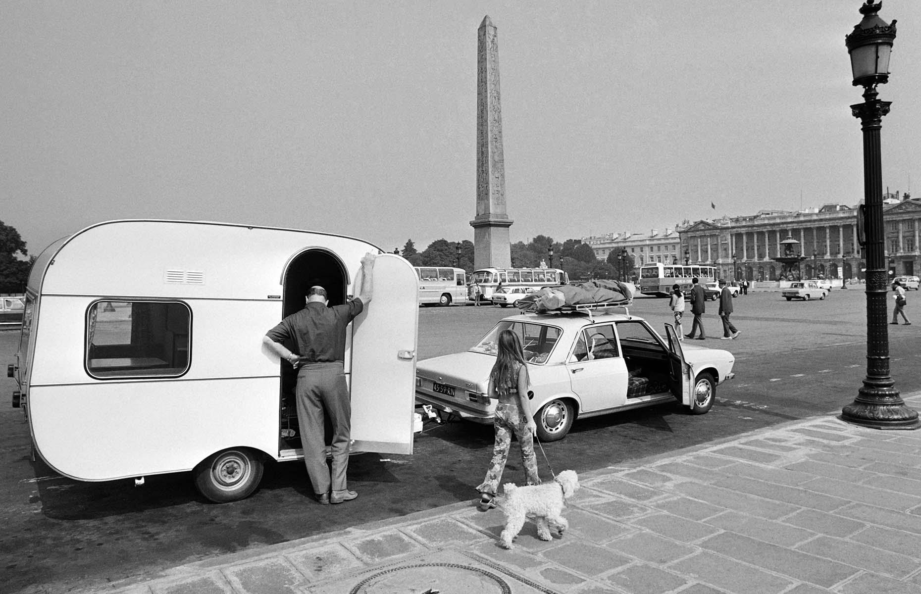 <p>In the post-war era, tourism to the French capital continued to increase. At the same time, road trips across Europe surged in popularity, with many embarking on longer trips during the summer vactions. Here, a Dutch tourist has parked his car and trailer in the heart of the Place de la Concorde in 1972. </p>  <p><strong><a href="https://www.loveexploring.com/guides/79619/explore-paris-places-to-see-what-to-do-and-where-to-stay">Discover what to see in Paris today</a></strong></p>