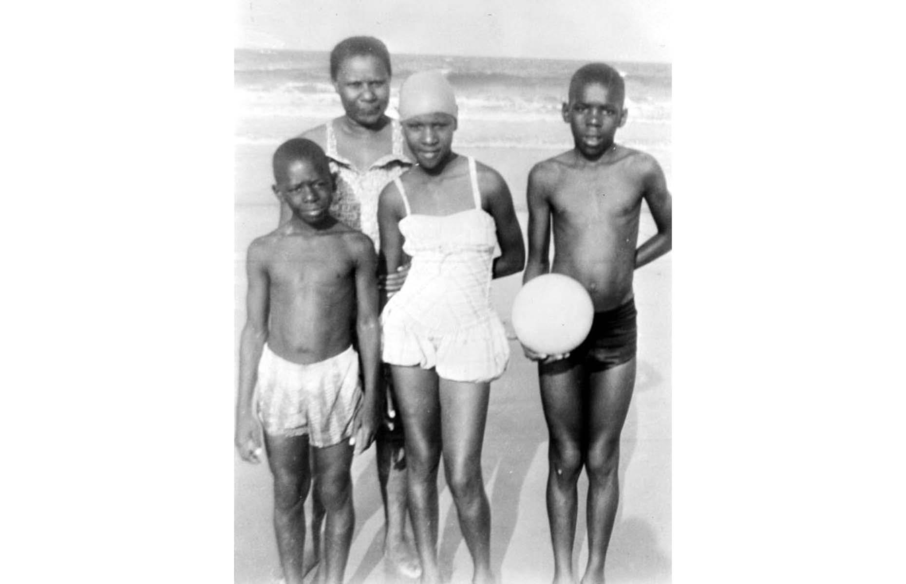 <p>Up until the mid-1960s, racial segregation affected most parts of life – even a simple family activity like going to the beach. As most areas in and around Jacksonville didn't welcome Black vacationers, several beaches for minorities popped up, most notably, American Beach on Amelia Island. The largest and most popular beach community among African Americans, American Beach Historic District is now listed on the National Register of Historic Places. Here, a family is photographed on American Beach in 1958.</p>