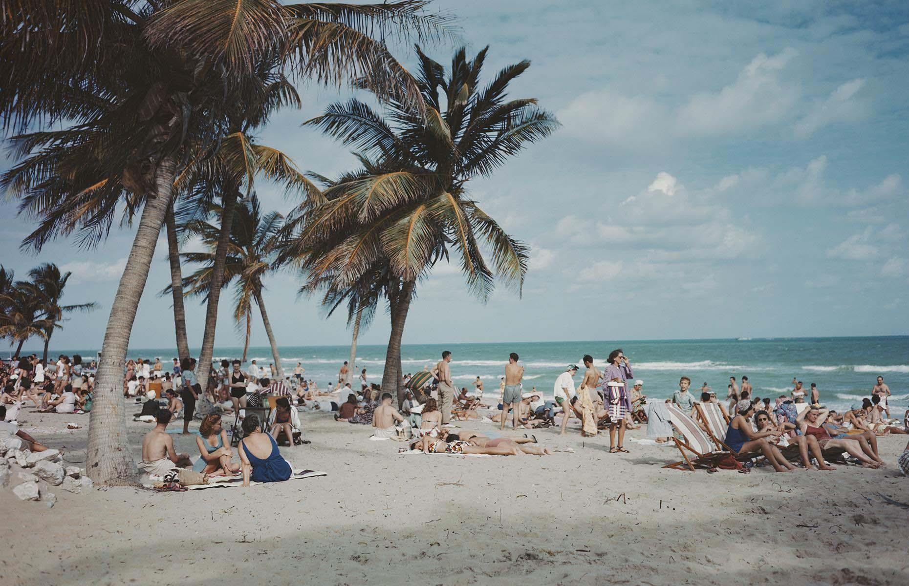 <p>Florida remained the destination of choice through the 1960s. As new hotels, resorts and amusements continued to spring up near the coast, the Sunshine State was flooded with people each summer and continues to be a popular vacation destination today. Here, sun-worshippers relax beneath the palms on Miami Beach in southern Florida circa 1965.</p>  <p><a href="https://www.loveexploring.com/galleries/114402/historic-images-of-the-worlds-famous-seaside-resorts?page=1"><strong>Take a look at more historic images of the world's famous seaside resorts</strong></a></p>