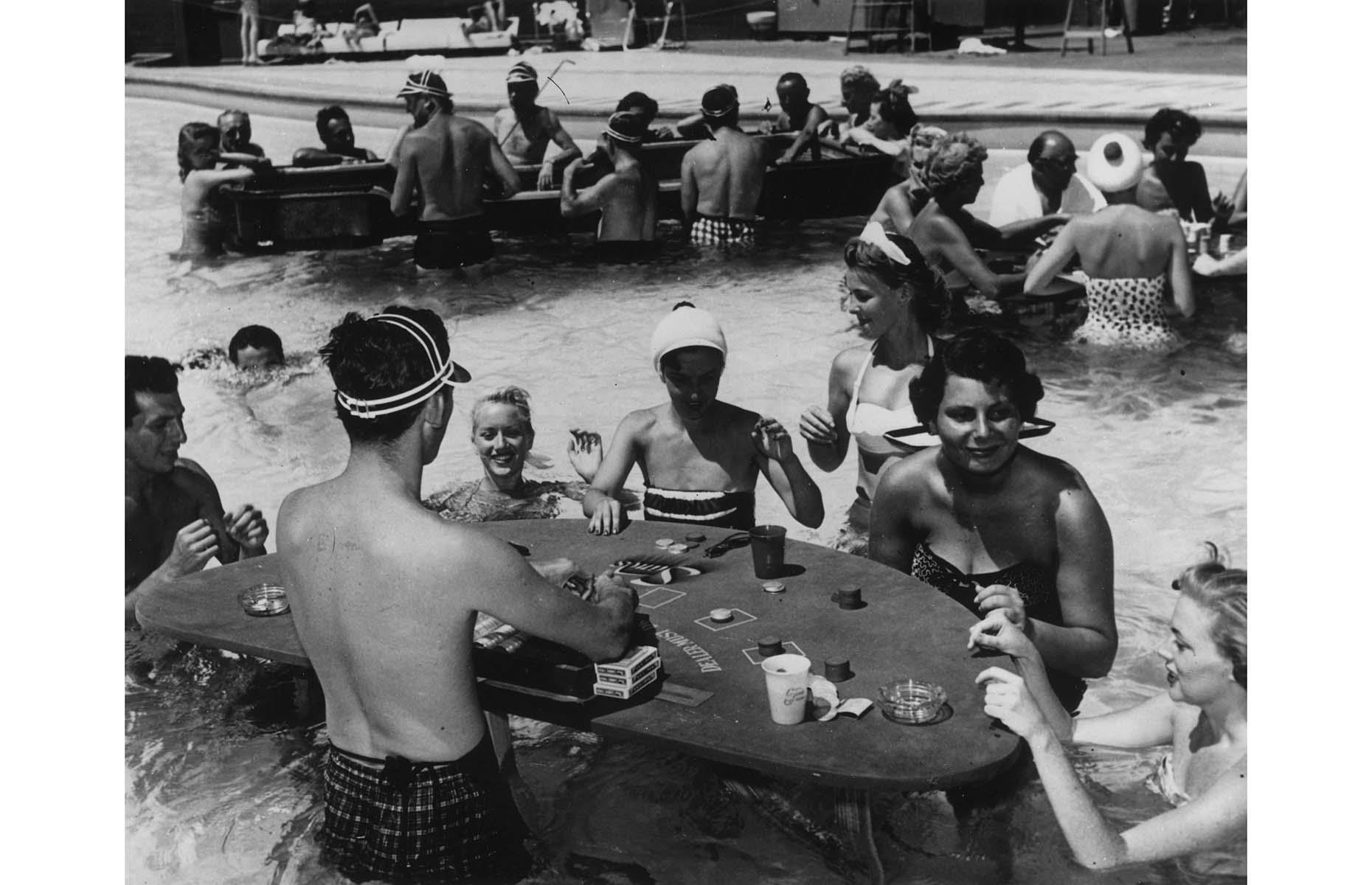<p>During the following decades, Las Vegas truly enjoyed its golden era. From legendary performers taking to stage every night to new hotels that gave the city its modern face, this was the place to let loose and enjoy life. Pictured is a croupier dealing a hand in a blackjack game at the famous swimming pool casino at the Sands Hotel in 1965.</p>  <p><a href="https://www.loveexploring.com/gallerylist/99342/sin-city-secrets-the-incredible-story-of-las-vegas"><strong>Read more about the incredible history of Las Vegas here</strong></a></p>