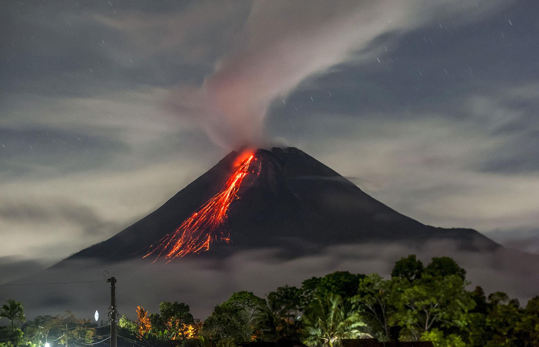 <p>In August 2021, Mount Merapi saw <a href="https://www.nbcnews.com/news/world/lava-streams-indonesia-s-mount-merapi-new-eruption-n1276886">its biggest eruption</a> in months. Lava flows reached more than two miles (3.2km) down the mountain and hot ash was spewed 2,000 feet (610m) into the sky. This photo from mid-September 2021 shows it still sending fiery lava down its slopes.</p>