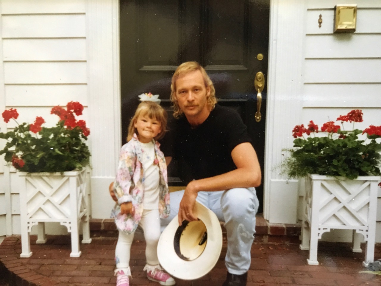 <p>Country music star Alan Jackson -- who has three girls with his wife, high school sweetheart Denise -- is seen here in the early '90s posing on the porch with their eldest, Mattie, when she was an adorable toddler. Keep reading to see the author all grown up...</p>