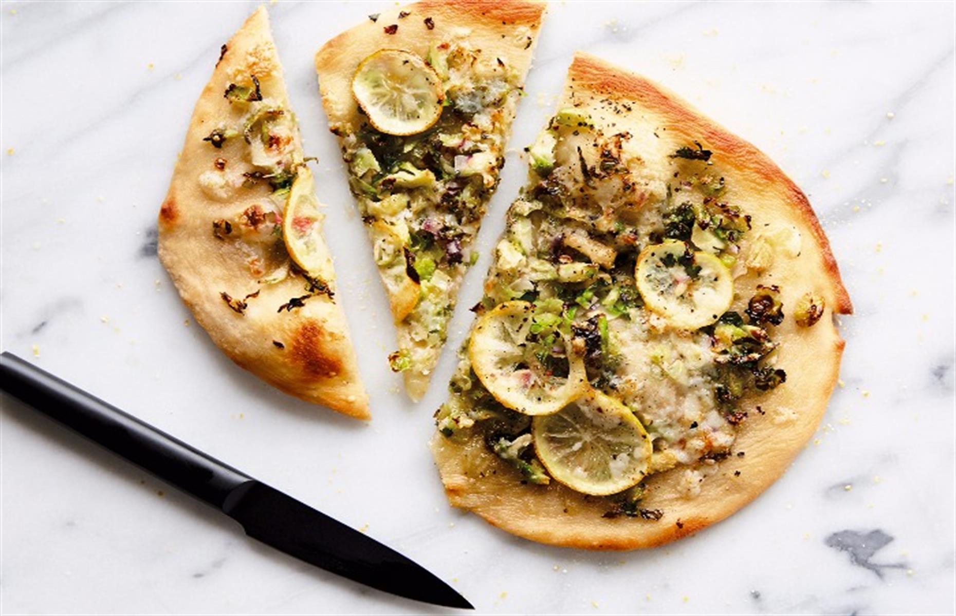 <p>Pizza is pretty tough on vegans, without that lovely bubbling cheese. But this recipe uses vegan mozzarella, which is not a bad substitute, plus shredded shallots, Brussels sprouts and slices of roasted lemon which have a very intense citrus flavor.</p>  <p><a href="https://www.lovefood.com/recipes/68142/vegan-pizza-recipe"><strong>Get the recipe for vegan pizza here</strong></a></p>