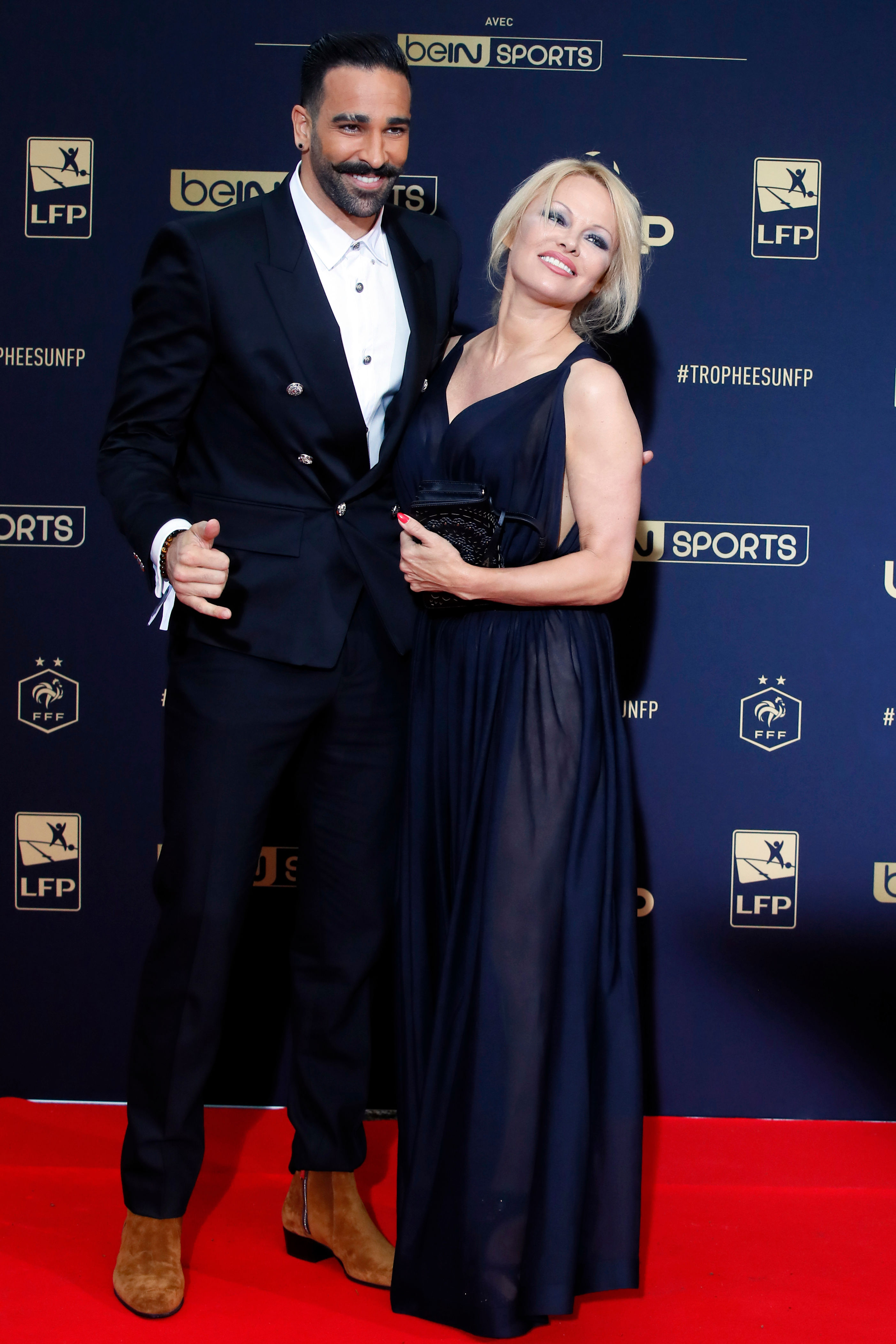 <p><span>In mid-2019, <a href="https://www.wonderwall.com/celebrity/profiles/overview/pamela-anderson-369.article">Pamela Anderson</a> accused her off-and-on boyfriend of more than two years, soccer star Adil Rami, of </span><a href="https://www.wonderwall.com/news/pamela-anderson-accuses-soccer-star-adil-rami-cheating-abuse-living-double-life-3020131.article">domestic violence</a><span> and of </span><a href="https://www.wonderwall.com/celebrity/couples/camila-cabello-shawn-mendes-dating-celeb-love-life-news-late-june-2019-hollywood-romance-report-3020161.gallery?photoId=1057747">cheating</a><span> on her with French model Sidonie Biemont -- with whom he shares young twin sons. Later, the French athlete denied the abuse allegations but admitted that he was seeing both women at the same time, writing that he "should have been more transparent in this ambiguous relationship."</span></p>