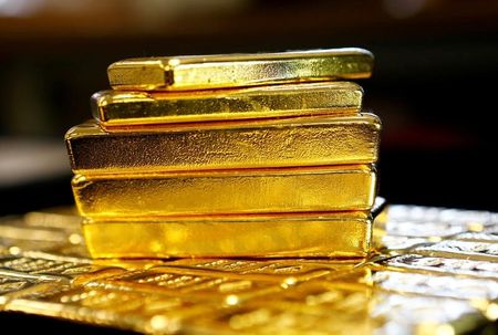gold sinks to 9-month lows as dollar flies to 20-year highs