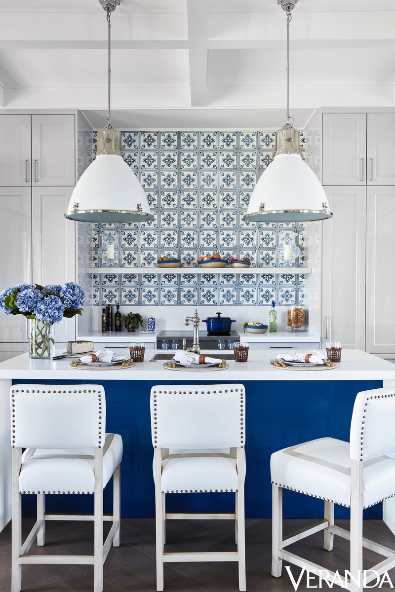 <p>At this Windsor, Florida, cottage, designer Alessandra Branca doubled down on storage in the small cookspace by taking the cabinetry all the way up to the room's relatively high ceilings. A slender "apartment width" range (typically 24 inches wide) tucks in behind the island for powerful, albeit small-scale, cooking.</p><p>A rustic <a href="http://www.casablancatile.com/">Casa Branca</a> tile backsplash contrasts a sleek lacquered <a href="https://www.siematic.com/en/">SieMatic</a> island. <a href="http://www.palecek.com/">Palecek</a> stools in a <a href="https://www.kravet.com/">Kravet</a> fabric with <a href="https://samuelandsons.com/">Samuel & Sons</a> trim. Fittings, <a href="https://go.redirectingat.com/?id=74968X1525088&xs=1&url=http%3A%2F%2Fwww.kohler.com%2Fcorporate%2Findex.html&sref=https%3A%2F%2Fwww.veranda.com%2Fdecorating-ideas%2Fa19833976%2Falessandra-branca-windsor-florida-village-suites%2F&xcust=%5Butm_source%7C%5Butm_campaign%7C%5Butm_medium%7C%5Bgclid%7C%5Bmsclkid%7C%5Bfbclid%7C%5Brefdomain%7Cgoogle.com%5Bcontent_id%7Cbe0949c9-1e96-4ab0-a1a4-e2ed88e68ef4%5Bcontent_product_id%7C%5Bproduct_retailer_id%7C">Kohler</a>. Pendants, <a href="https://www.circalighting.com/">Circa Lighting</a>.</p>