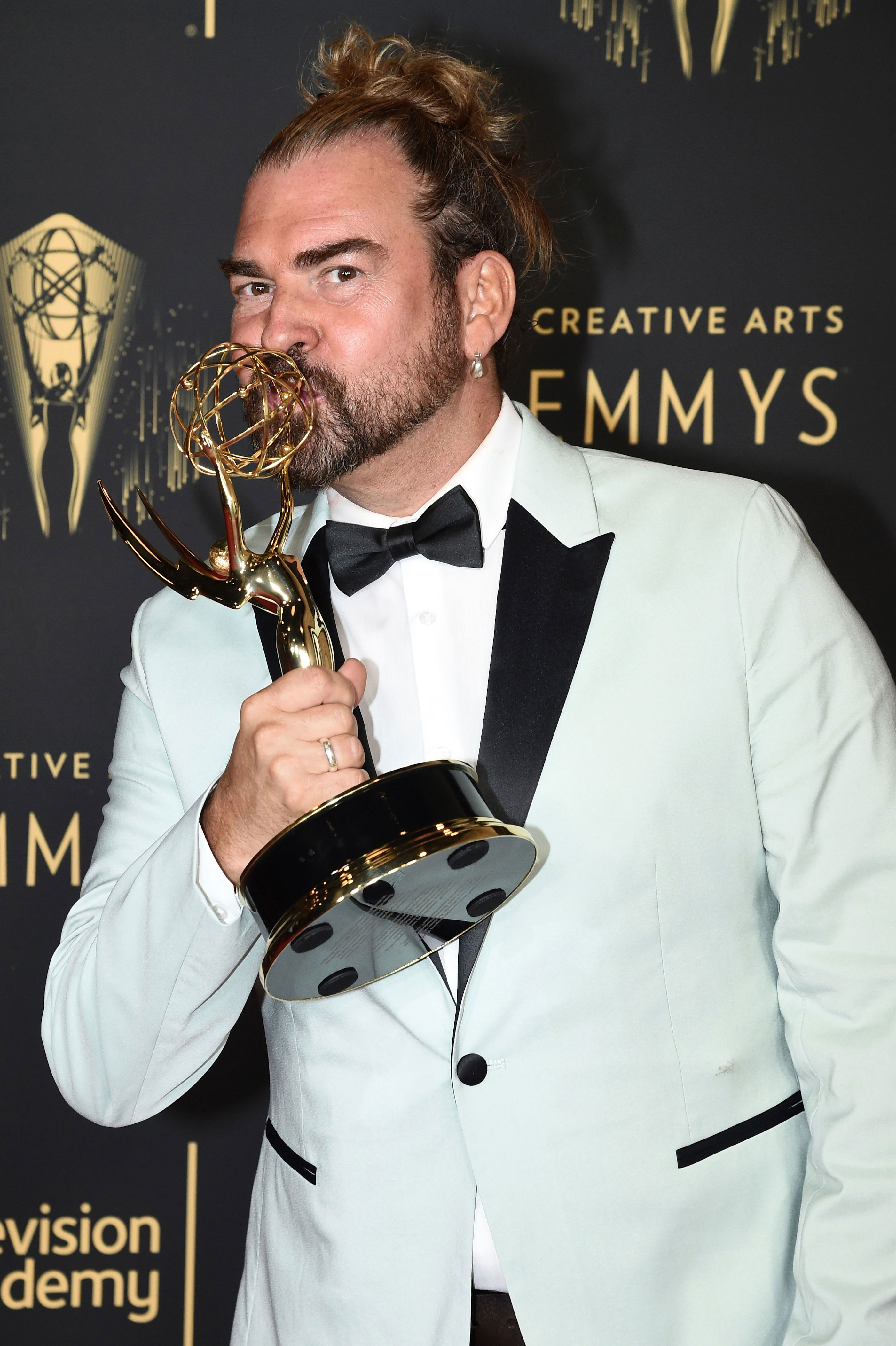 <p>On Oct. 3, 2021 -- just weeks after winning an Emmy on Sept. 11 at the 2021 Creative Arts Emmy Awards for his hairstyling work on the hit Netflix series "Bridgerton" -- Oscar-nominated hair and makeup designer Marc Pilcher died from COVID-19, his agency, Curtis Brown, confirmed to <a href="https://variety.com/2021/artisans/news/marc-pilcher-dead-dies-bridgerton-hair-makeup-1235080234/">Variety</a>. Marc, 53, was double vaccinated and had no underlying health conditions, his family told Variety, adding that he'd tested negative multiple times before traveling from Britain to Los Angeles for the Creative Arts Emmys ceremony and that not long after his return home, he became sick and his condition quickly deteriorated. Marc notably worked on London's West End on many theater productions as well as on Hollywood projects including "Mary Queen of Scots" with Saoirse Ronan and Margot Robbie (for which he earned his Academy Award nod), "Downton Abbey," "Beauty and the Beast," "My Week With Marilyn" and more. "So heartbroken by the loss of Marc Pilcher, the brilliant and visionary Hair and Makeup designer for Bridgerton Season One," "Bridgerton" star Nicola Coughlan shared on Instagram. "Marc was so passionate about his work and so tremendously talented. Not even a month ago he won his first Emmy award. It's a tragedy that he's been taken so young when he had so much yet to do."</p>