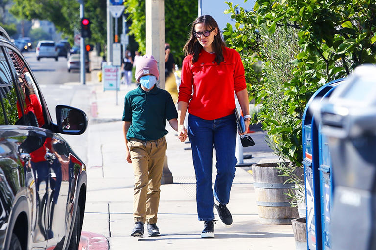 Jennifer Garner held her son Samuel’s hand on a shopping trip to LA’s Brentwood Country Mart on Sep. 20, 2021. She rocked a red top for the mother-son outing to fetch treats at the upscale Edelweiss Chocolates.