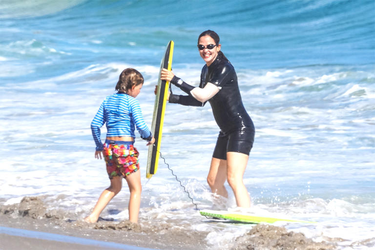 Jennifer Garner slips into a wet suit for some bodyboarding fun with her son Samuel in Malibu. Jen looked like a total pro in the water! 