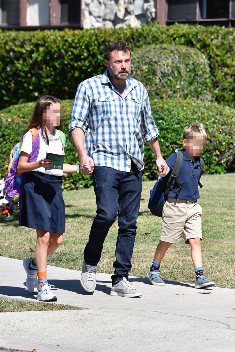 Ben Affleck picks up Seraphina and Samuel after school. Ben looks casual for the outing in a plaid button-up and blue jeans.