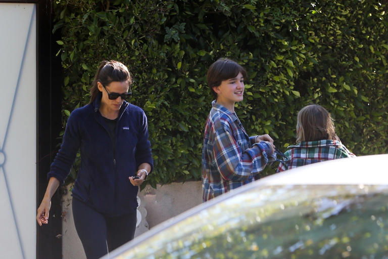 Jennifer Garner picks up daughter Seraphina and son Sam from a friend’s house in Santa Monica, Calif. on Oct. 9, 2021. The kids sported matching PJs while mom was stylish in leggings and a zip-up.