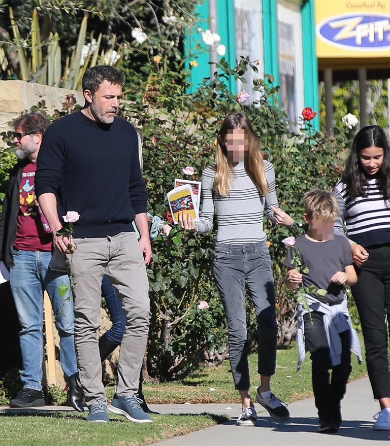 Ben Affleck heads to church with his kids and ex-wife, Jennifer Garner. Here, Ben and son, Samuel, and daughter, Violet, enjoy the sun while holding flowers from the Advent service.  