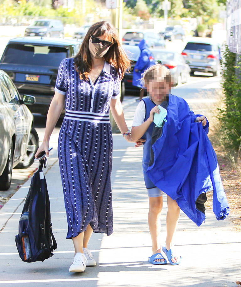 Jennifer Garner was seen picking her son Samuel Affleck up from a swim practice in June 2021. She wore a flowing navy blue dress as she carried his backpack to her car.