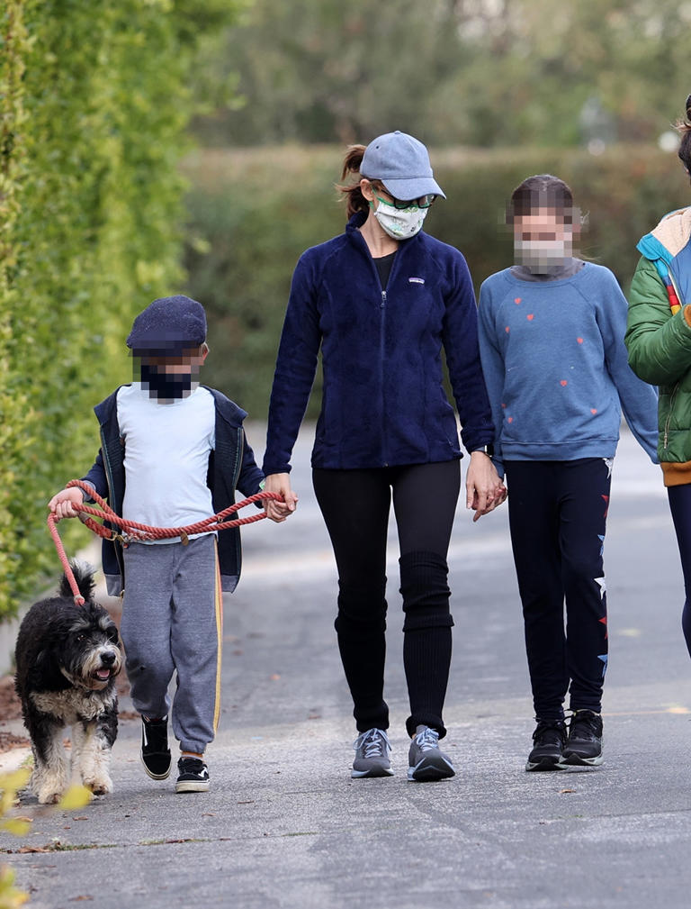 Jennifer Garner put her DIY skills to work wearing homemade masks she and the kids made for a walk. Jennifer had some fun and danced with the kids during their walk around the neighborhood.