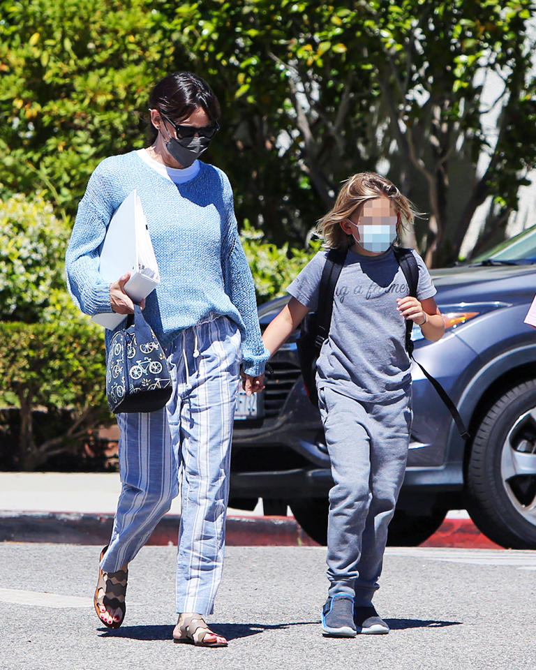 Jennifer Garner holds hands with her son Samuel Affleck after picking him up from school. They were headed to a beach party.