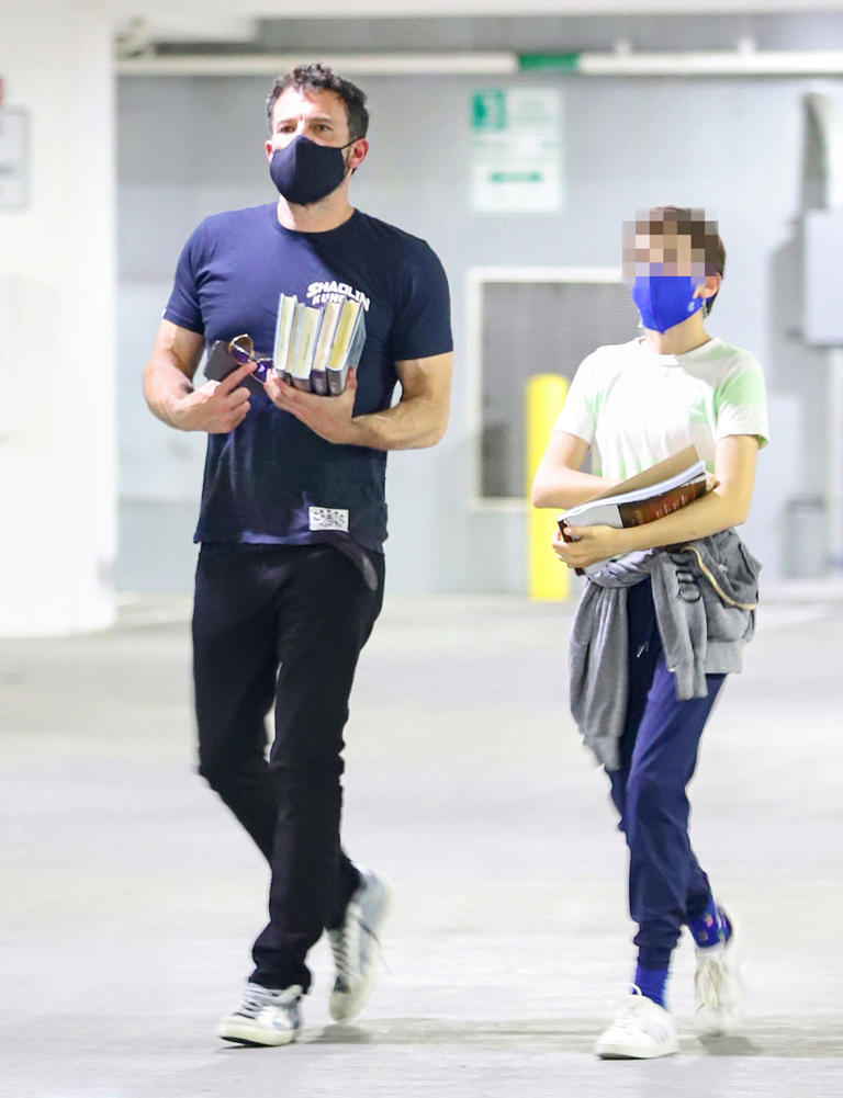 Ben Affleck spends quality time as the doting dad taking daughter Seraphina to the library after that steamy kiss and night out with Jennifer Lopez on June 14, 2021. He helped his daughter carry their books during the outing.