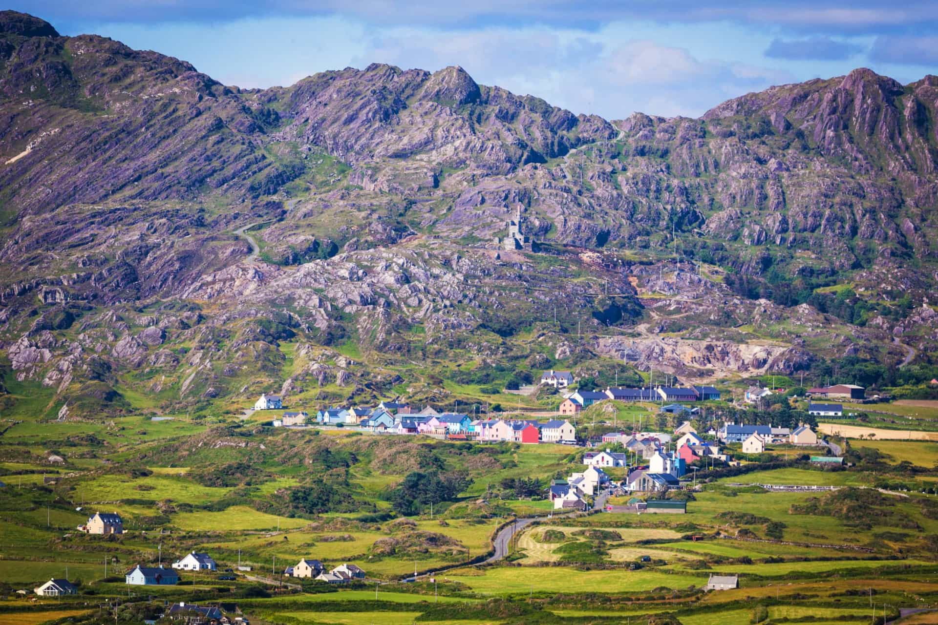<p>Revenue generated from copper mining built Allihies, a village located at the western tip of the Beara Peninsula. The Allihies Copper Mine Museum commemorates the area's mining heritage, while the engine house of the Mountain Mine (center of photograph) stands as a permanent reminder of a once-thriving industry.</p>