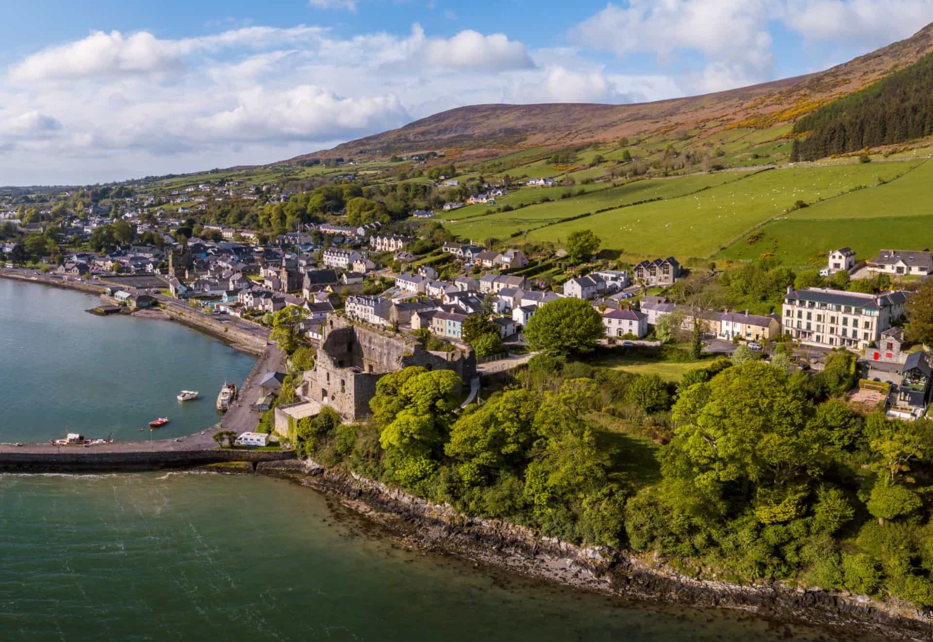 <p>Carlingford sits on the Cooley Peninsula, between the waters of Carlingford Lough and the mountain of Slieve Foye. The coastal town is recognized for its medieval layout, noticeable by the narrow lanes and small streets threading through it center.</p><p>Sources: (<a href="https://www.republicworld.com/entertainment-news/hollywood-news/where-was-the-quiet-man-filmed-here-are-shooting-locations-of-this-50s-classic.html" rel="noopener">Republic Word</a>) (<a href="https://www.history.com/news/remembering-annie-moore-ellis-islands-first-immigrant" rel="noopener">History</a>)</p><p>See also: <a href="https://www.starsinsider.com/celebrity/474993/your-favorite-irish-actors-ever">Your favorite Irish actors ever</a></p>