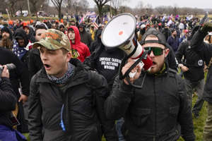 Proud Boys members Zachary Rehl, left, and Ethan Nordean, right, walk toward the U.S. Capitol in Washington in support of President Donald Trump on Jan. 6, 2021.