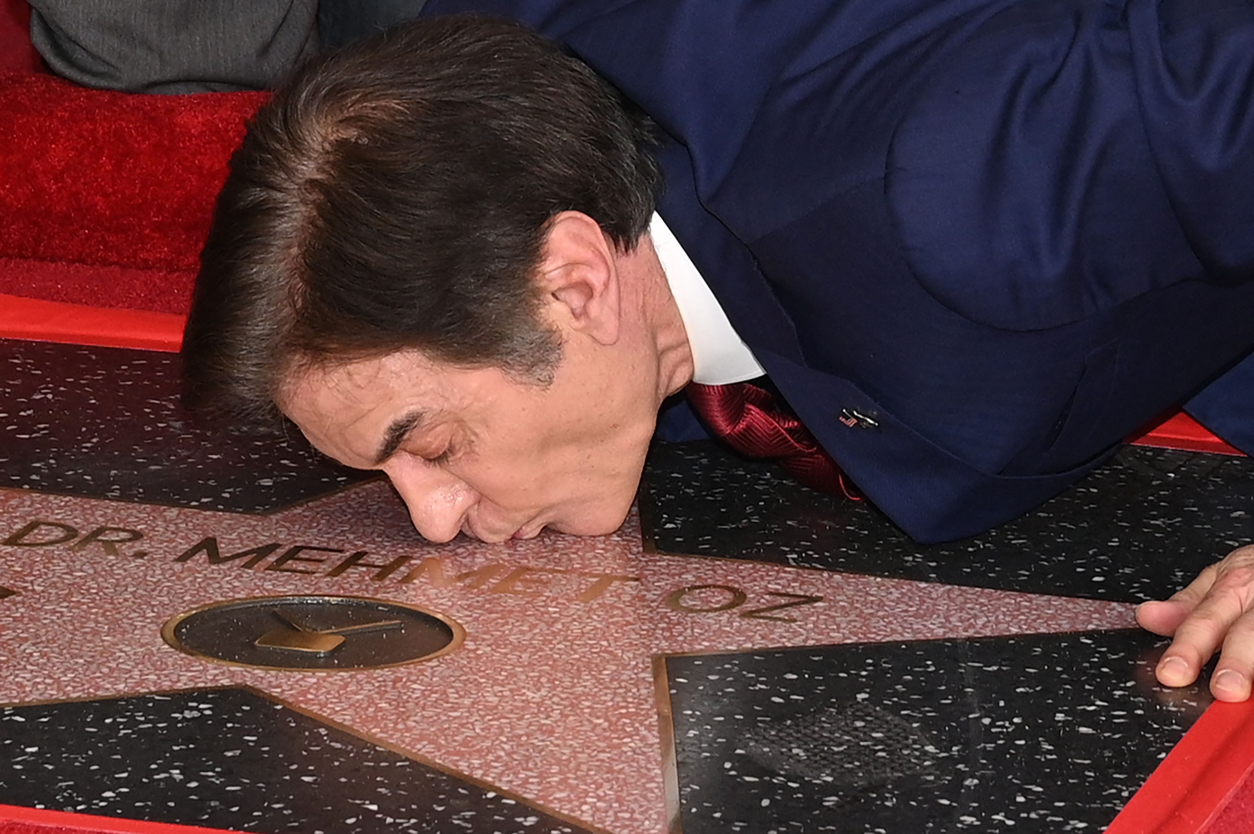 Stars on stars on stars! Since 1960, the Hollywood Chamber of Commerce has been honoring famous faces in music, film, TV and more by putting their names on terrazzo and brass stars down Hollywood Boulevard. There are now more than 2,600 stars on the Walk of Fame, a popular tourist destination in Hollywood, California.<br> <br> Scroll through to see some of your favorite celebrities get their stars, starting with television host Dr. Mehmet Oz, whose star was unveiled on Feb. 11, 2022.