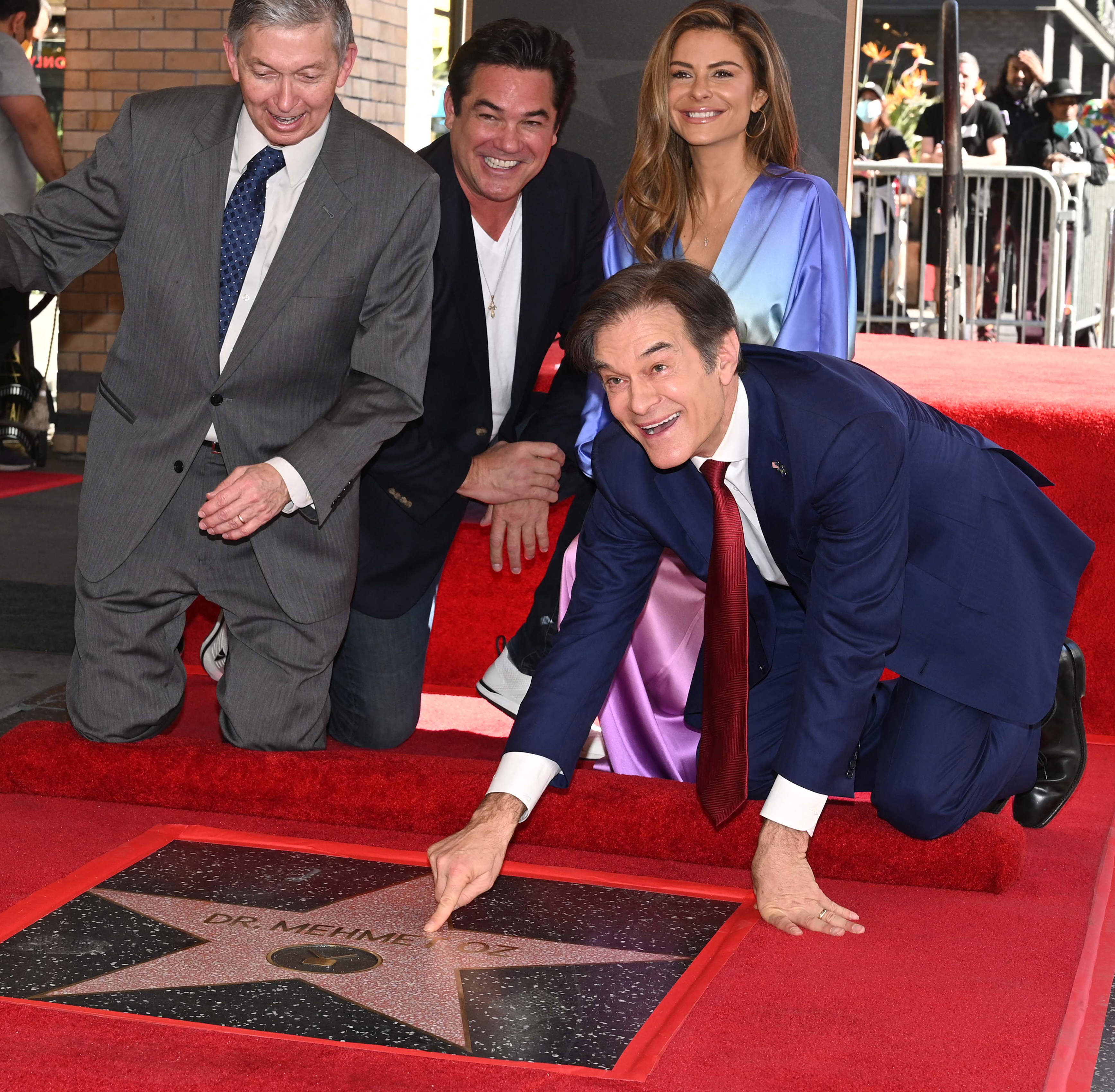 The celebrity heart surgeon, who recently ended his daytime TV “Dr. Oz Show” to run for U.S. Senate in Pennsylvania, got his star Friday on the Hollywood Walk of Fame just as he was being attacked 2,000 miles away in a rival’s TV ad saying he’s too “Hollywood.”<br> <br> Oz was introduced at the ceremony by TV personality Maria Menounos (second from right) and actor Dean Cain (second from left), and gave a seven-minute speech that echoed themes of his campaign that have positioned him as a free-thinking health expert who helps people.