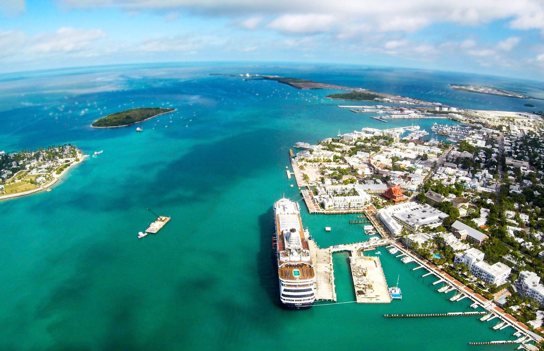 <p>Packed with culture, history and world-class diving and fishing spots, it’s easy to see why Key West is the most famous island of the <a href="https://www.loveexploring.com/guides/73827/explore-the-florida-keys-where-to-stay-what-to-eat-the-top-things-to-do">Florida Keys</a>. As the state's southernmost point, the island feels like its own little world where Caribbean-style pastel-hued villages serve as adorable B&Bs and impossibly clear waters are bordered by pretty palm-fringed shores. Writers have always loved the Keys, the island’s tin roof houses were once home to the likes of Ernest Hemingway and Tennessee Williams. Hemingway Home & Museum, where the famous author lived for more than 10 years, has become a major tourist hot spot.</p>