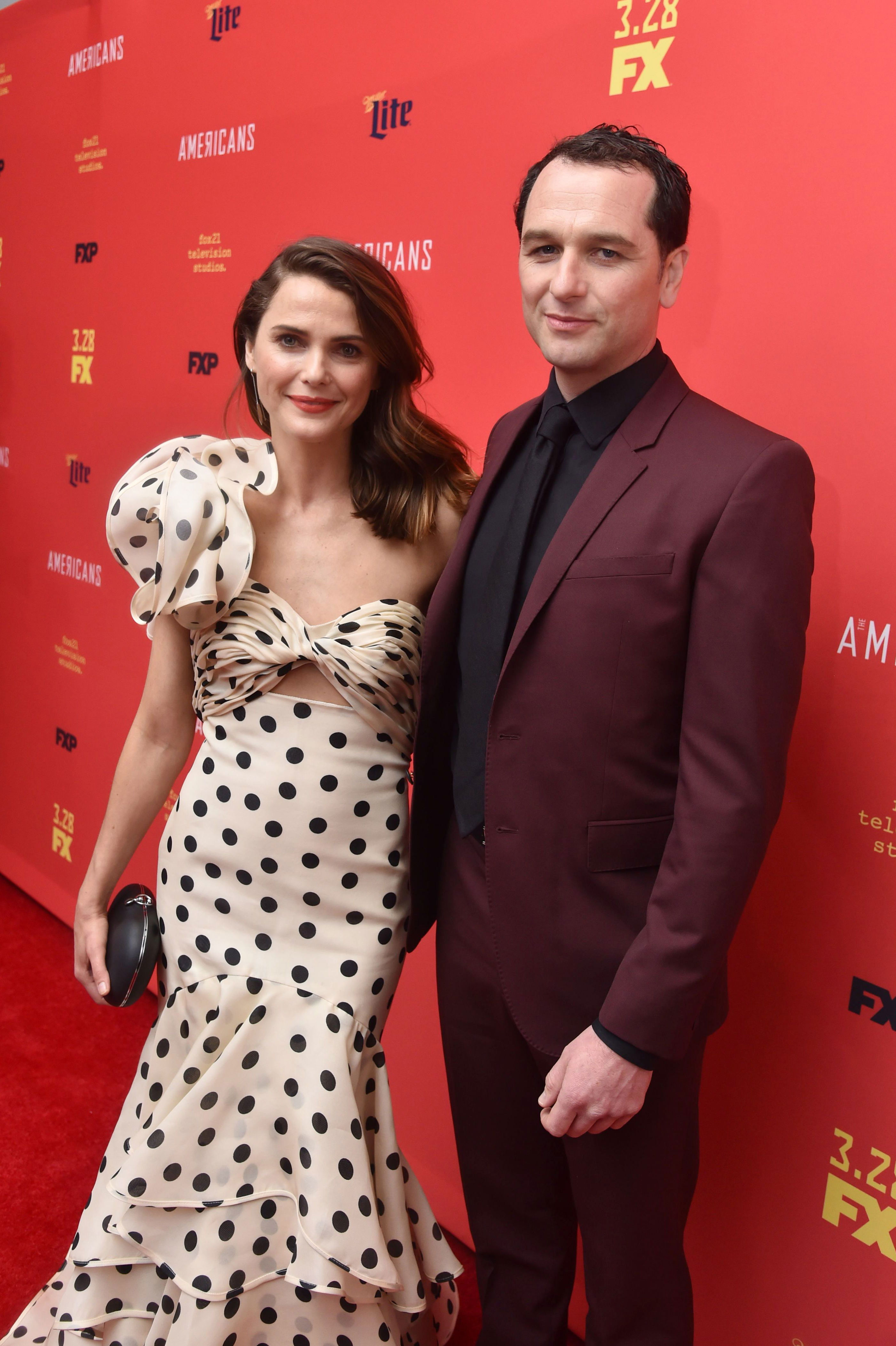 <p>On "Watch What Happens Live with <a href="https://www.wonderwall.com/celebrity/profiles/overview/andy-cohen-1524.article">Andy Cohen</a>" in 2017, Keri Russell and Matthew Rhys dished on how they first met and later fell in love on the set of "The Americans." Said the Welsh actor, "We actually met a very long, long time ago, and I very drunkenly asked her for her number when she was a young, single slip of a thing. So I sort of knew then when I was 26 [circa 2000]. ... It was in a parking lot [after a kickball party]. Very romantic. And she asked me to open a beer." Matthew added that his attraction to Keri was rekindled when they started working together: "It took a while," he said as she laughed. Keri chimed in, "Basically we did all the readings together and all the things and then after a heavy dose of a fight training, all sweaty at a lunch, he said, 'You know we've met before,' and I said, 'No, we haven't.' And he said, 'Yeah, we met before, like 10 years ago.'" Said Matthew to Keri, "I left you a drunken message, and you were like, 'Oh, I'm shocked that I didn't call you back.'" Recalled the actress, "As soon as he said that, I knew exactly what he was [talking about], and I said, 'Of course, I remember that.'" Joked the actor, "'You were that buffoon that wouldn't stop calling!'" After ending her marriage to carpenter Shane Deary, Keri and Matthew got together in 2013 and welcomed son Sam in 2016.</p>