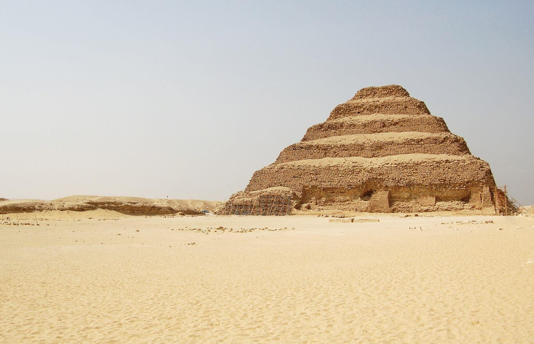 <p>Possibly Egypt’s strangest-looking pyramid is the Djoser Pyramid, located in Saqqara, in the ancient capital of Memphis. Djoser (2650 to 2575 BC) was the first king to use stone in a pyramid’s construction; before this, they were simple rectangular monuments made from clay bricks. Its formation is the work of the architect Imhotep, who ‘stacked’ the rectangle-shaped matabas (a rectangular Egyptian tomb) to create this step pyramid. It was the first of its kind, with its tier-like appearance and materials used, and stands at 204 feet (62m) high.</p>