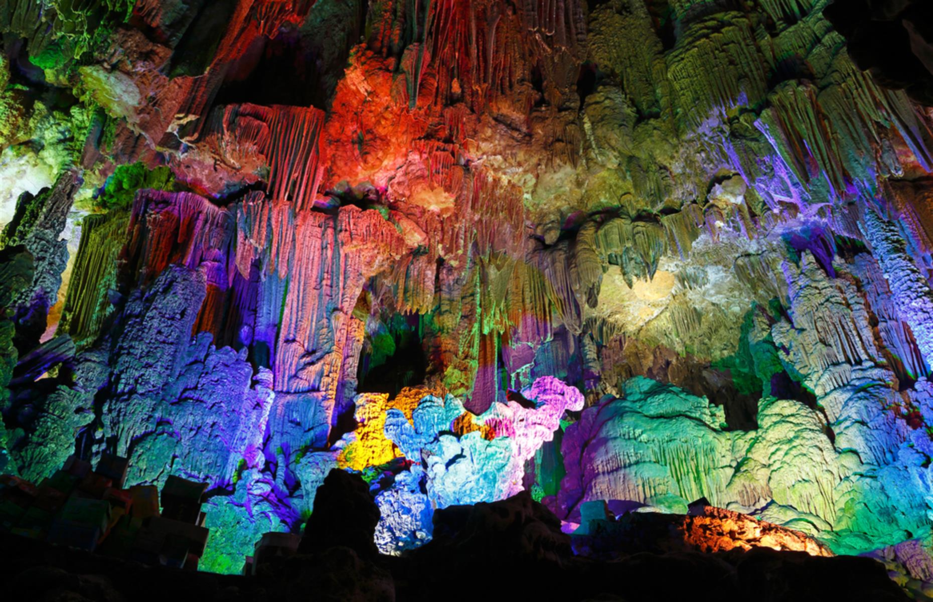 <p>Aptly named Reed Flute Cave near Guilin in southern China is so-called because of the reeds that grow in the area that are used to make flutes. The caverns are lit with brightly colored rainbow lights and collectively is otherwise known as the 'palace of natural art'. There are inscriptions here from as far back as the Tang Dynasty (AD 792).</p>