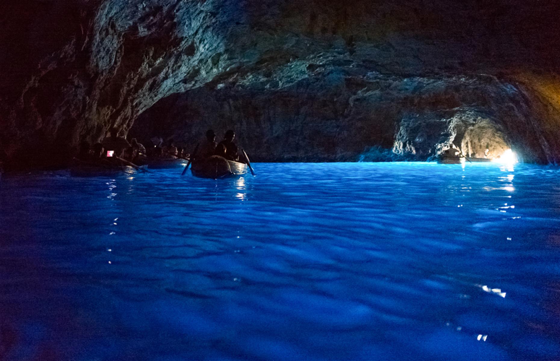 Capri, in Italy's Bay of Islands, is famous for its 'blue cave', where the sun illuminates the water from beneath the cave entrance and gives it that piercing bright blue color. It’s a small cavern and dozens of wooden rowboats bring tourists here each day when the weather is good (early afternoon is the best time to see the blue at its most mesmerizing).