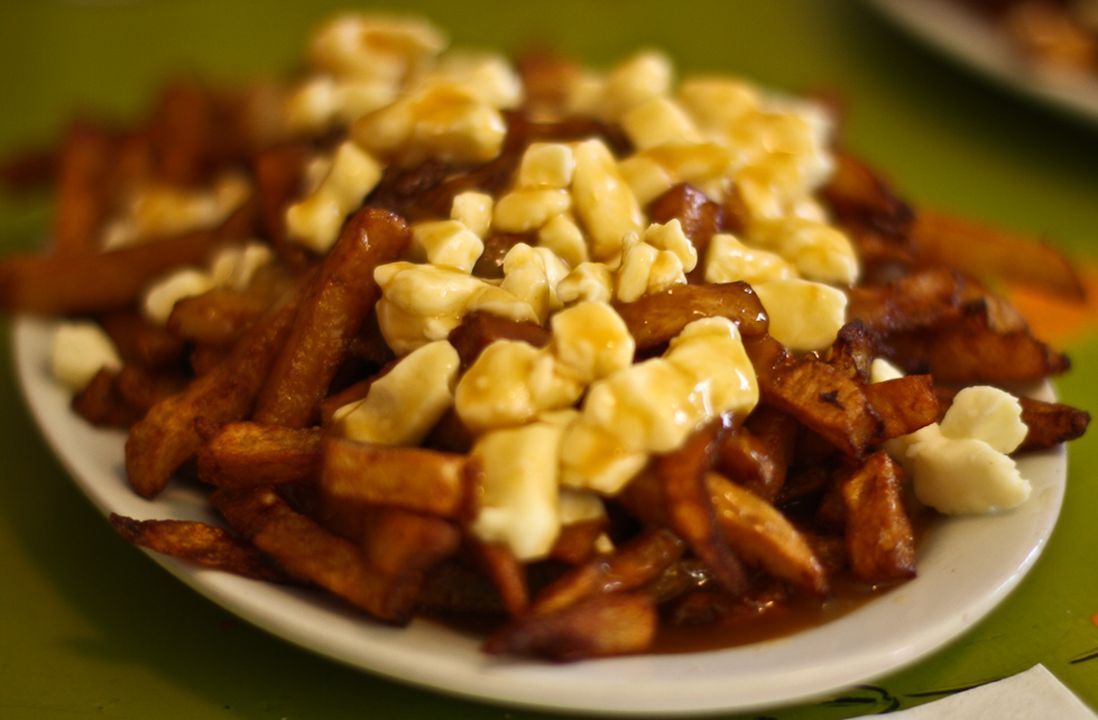 <p>In 1957, a customer reportedly asked the owner of a Quebec restaurant to serve him fries and cheese in the same bag, remarking, “Ça va faire toute une poutine!” which translates to <em>That’ll make a big mess!</em> Seven years later, <a href="https://labanquise.com/en/poutine-history.php">Jean-Paul Roy</a> added a characteristic brown sauce to the dish, and it became so famous that the saucier was crowned the “inventor of poutine” in 1998.</p>