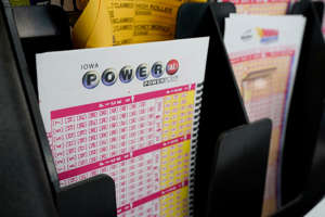 Blank forms for the Powerball lottery sit in a bin at a local grocery store, in Des Moines, Iowa.